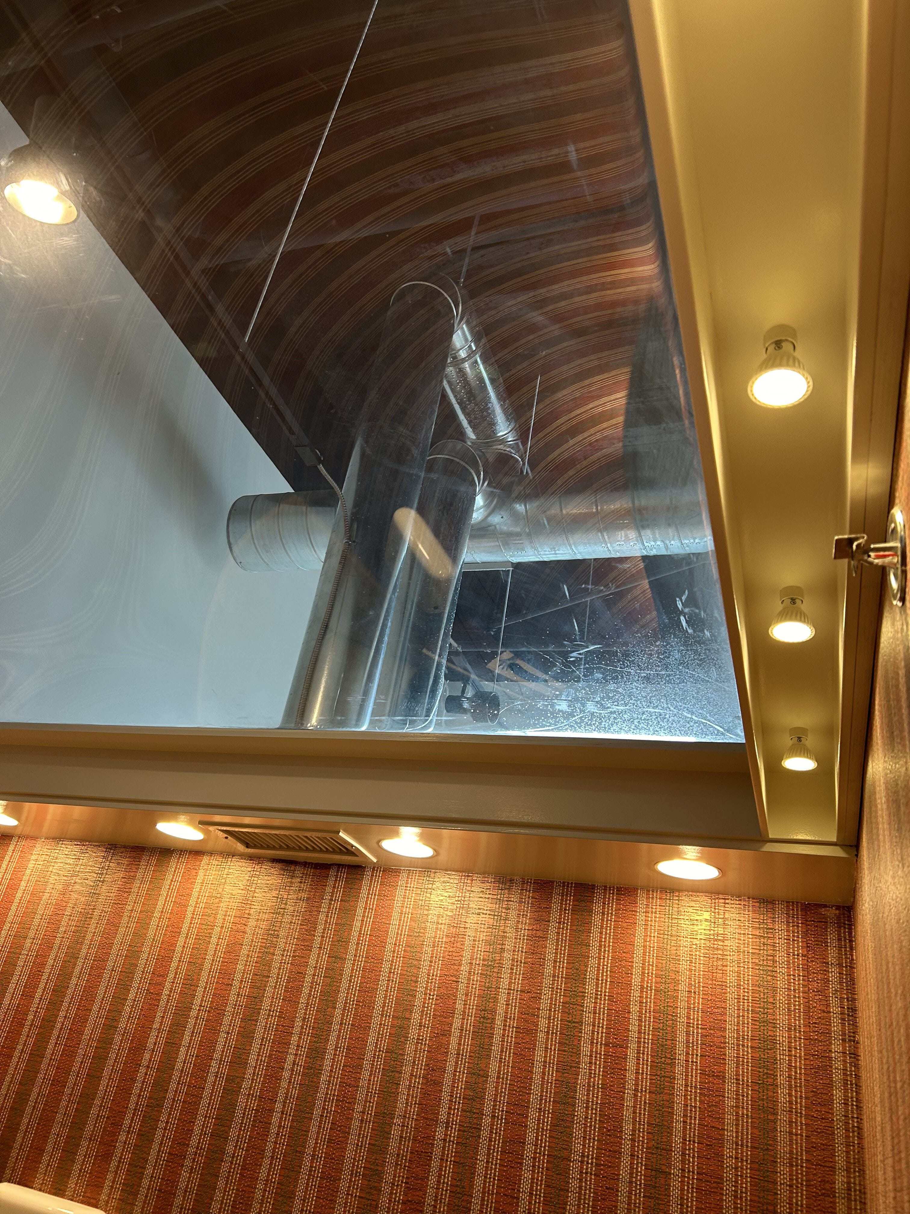Bathroom under construction with mirror and sink